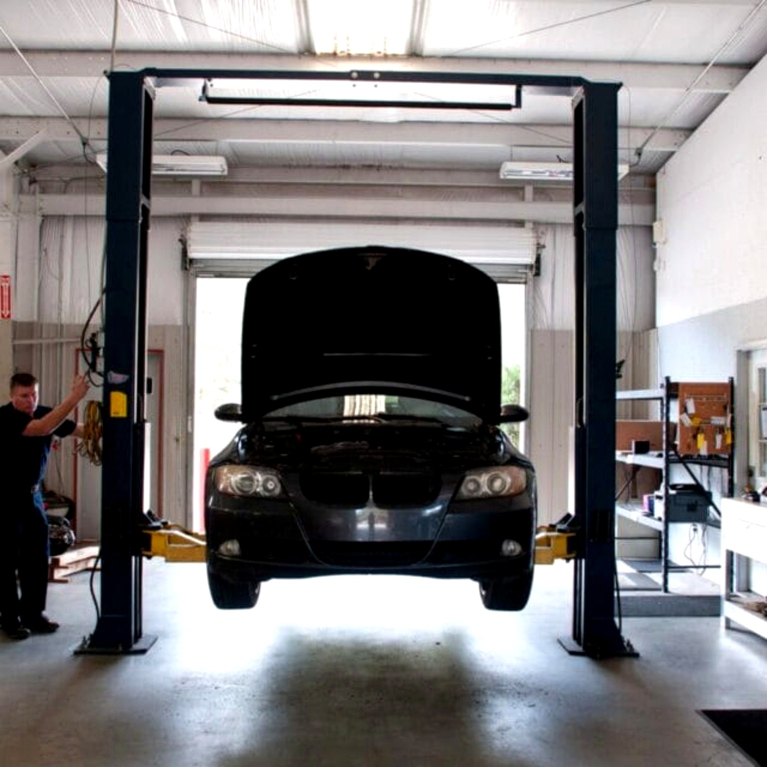Vehicle raised on a shop lift